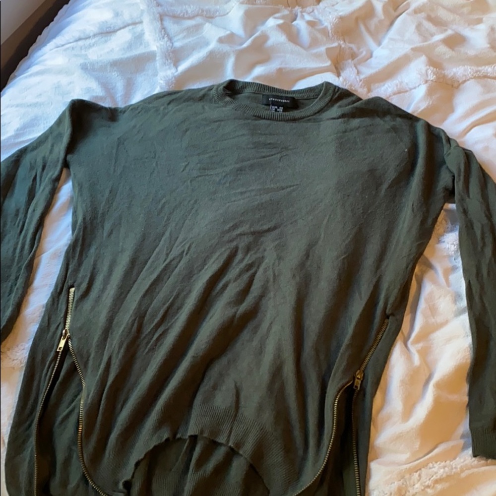 Green sweater with gold zipper detail